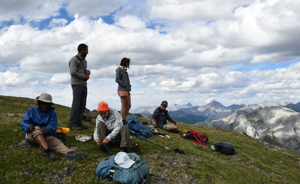 TJ (far right) and other members of his Summer 2022 Mongolia cohort, taking a rest while out completing fieldwork in the Darhad Valley. Photo: G. Goodwin