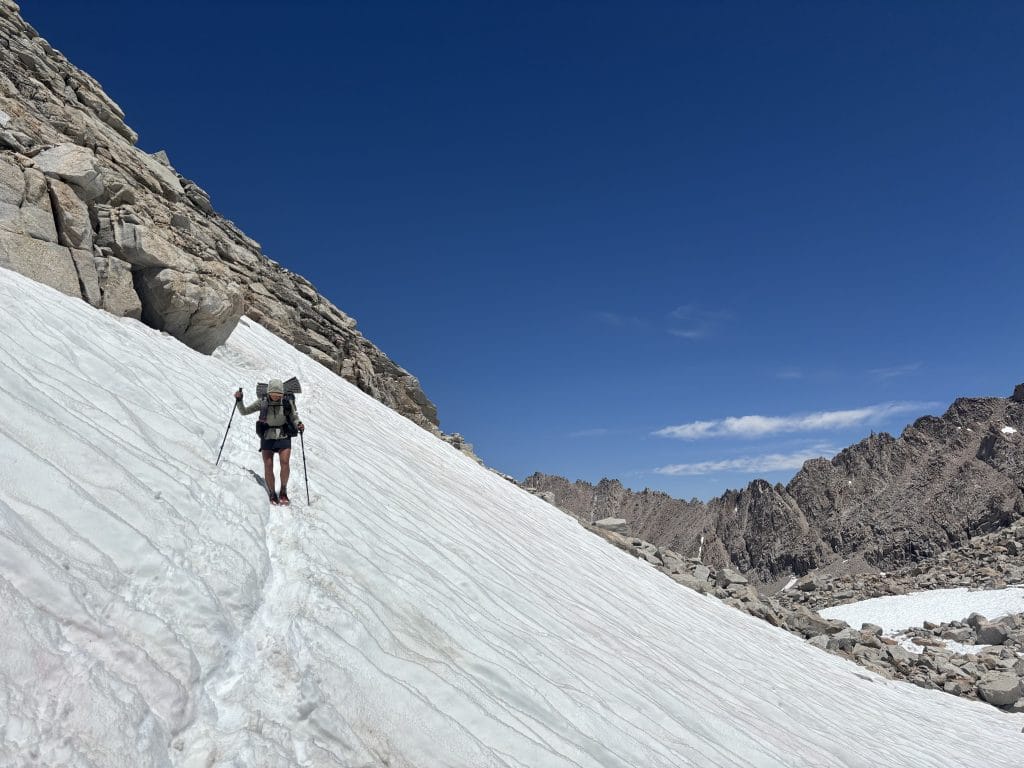 Traversing steep, snowy slopes and beautiful alpine meadows.