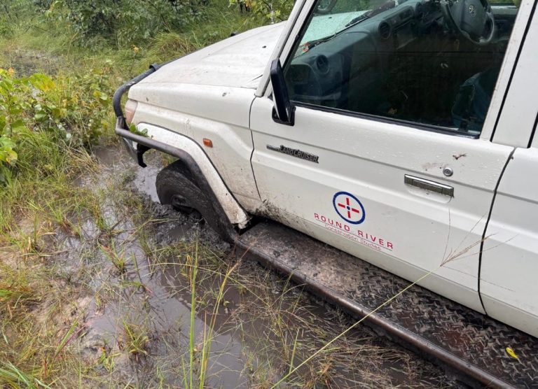Round River vehicle, "Lucy," stuck in the mud. Photo by C. Murphy.
